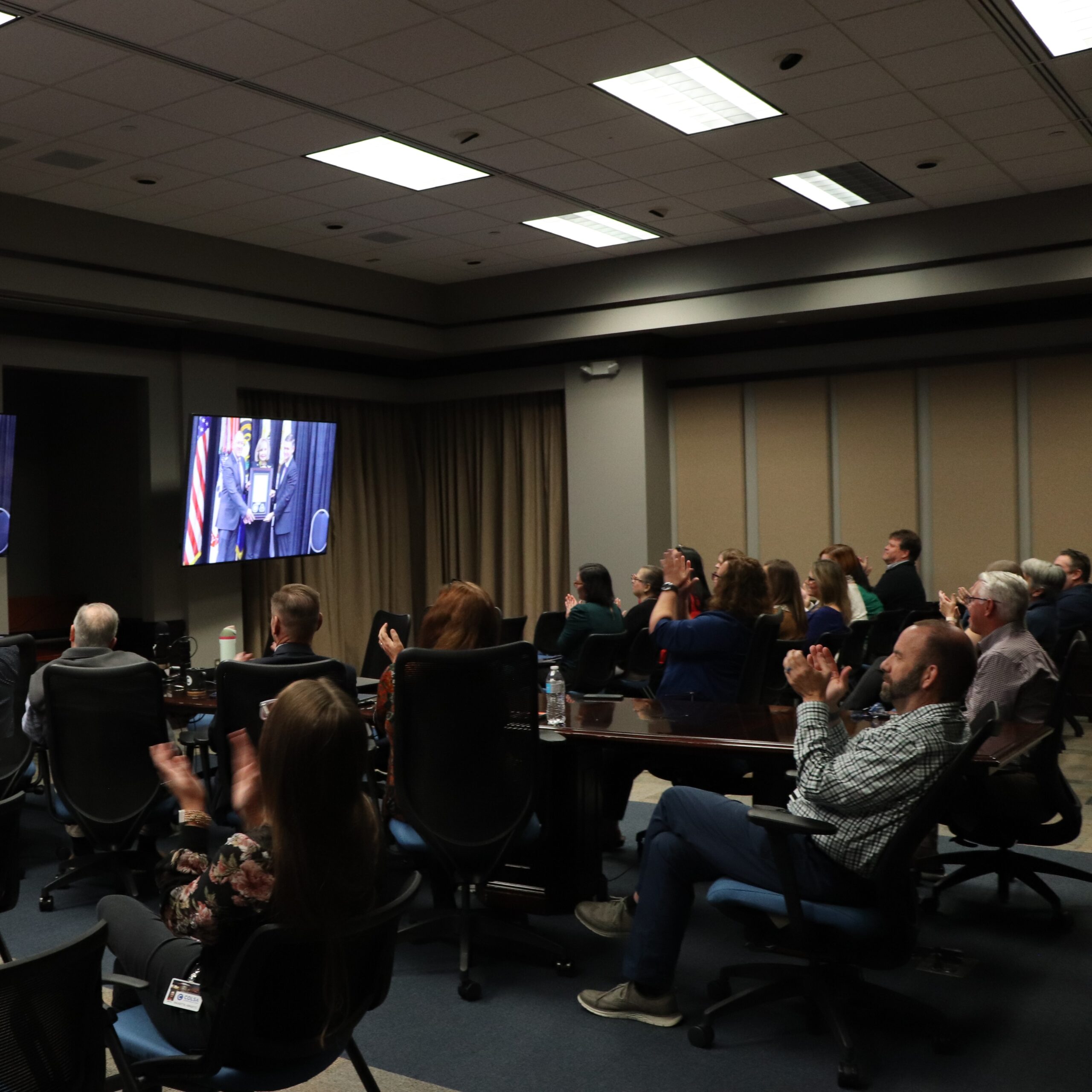 COLSA Headquarters livestreaming Cathy Dickens' award ceremony.